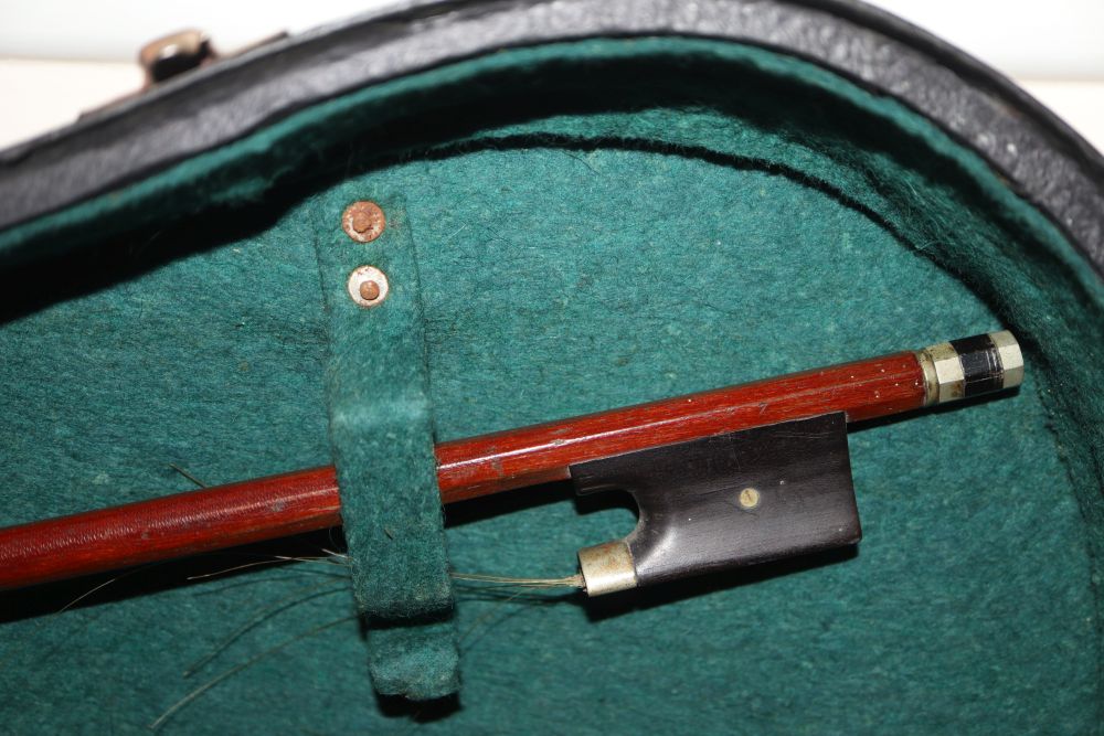 A 20th century Antonius Stradivarius Cremonensis violin, cased with two bows